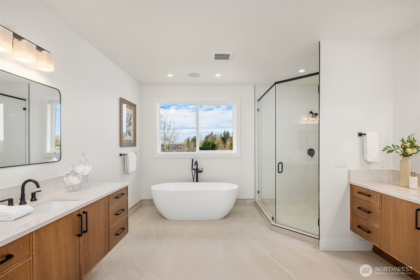 510 Nile Avenue Northeast Renton, WA 98059 - Photo 33 of 40 a spacious bathroom with a double vanity sink double mirror and bathtub