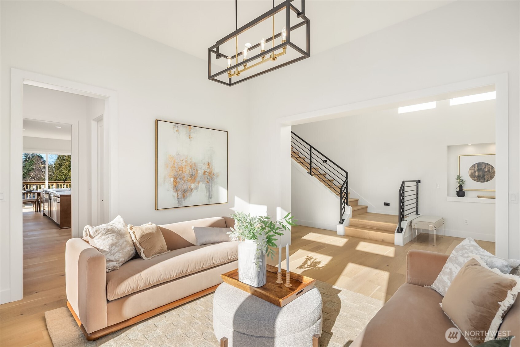 510 Nile Avenue Northeast Renton, WA 98059 - Photo 4 of 40 a living room with furniture and a chandelier