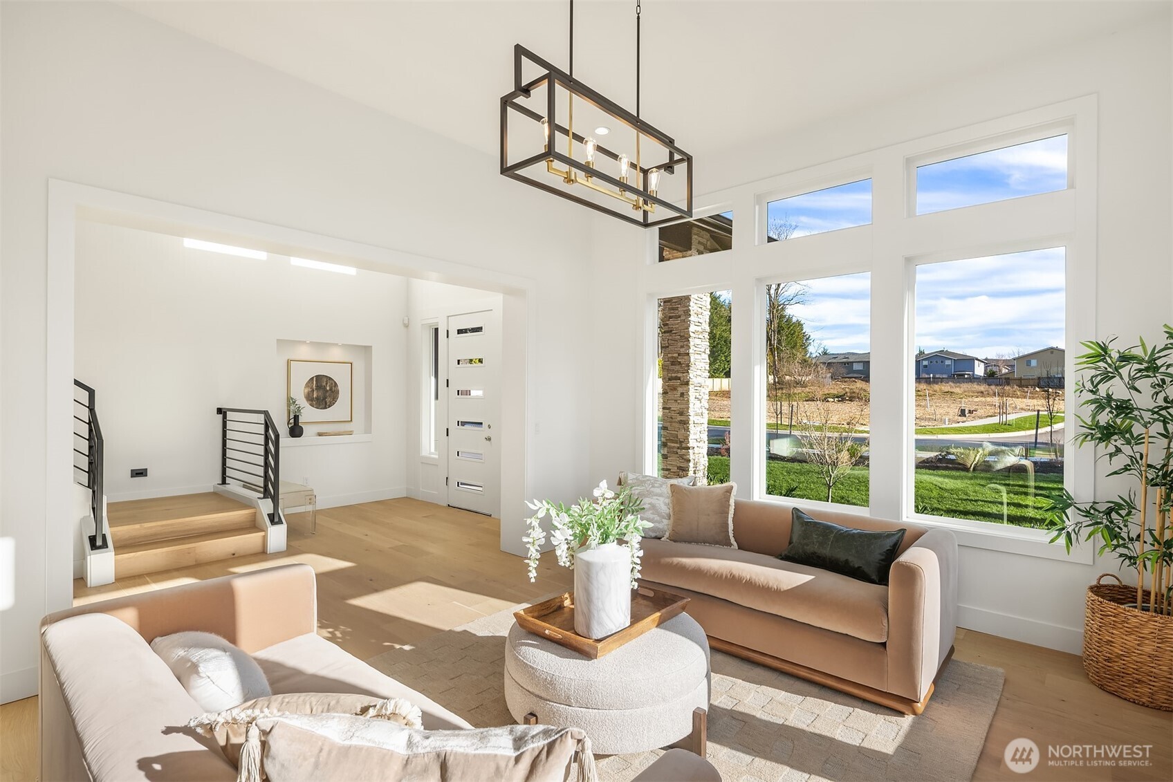 510 Nile Avenue Northeast Renton, WA 98059 - Photo 6 of 40 a living room with furniture a window and a chandelier