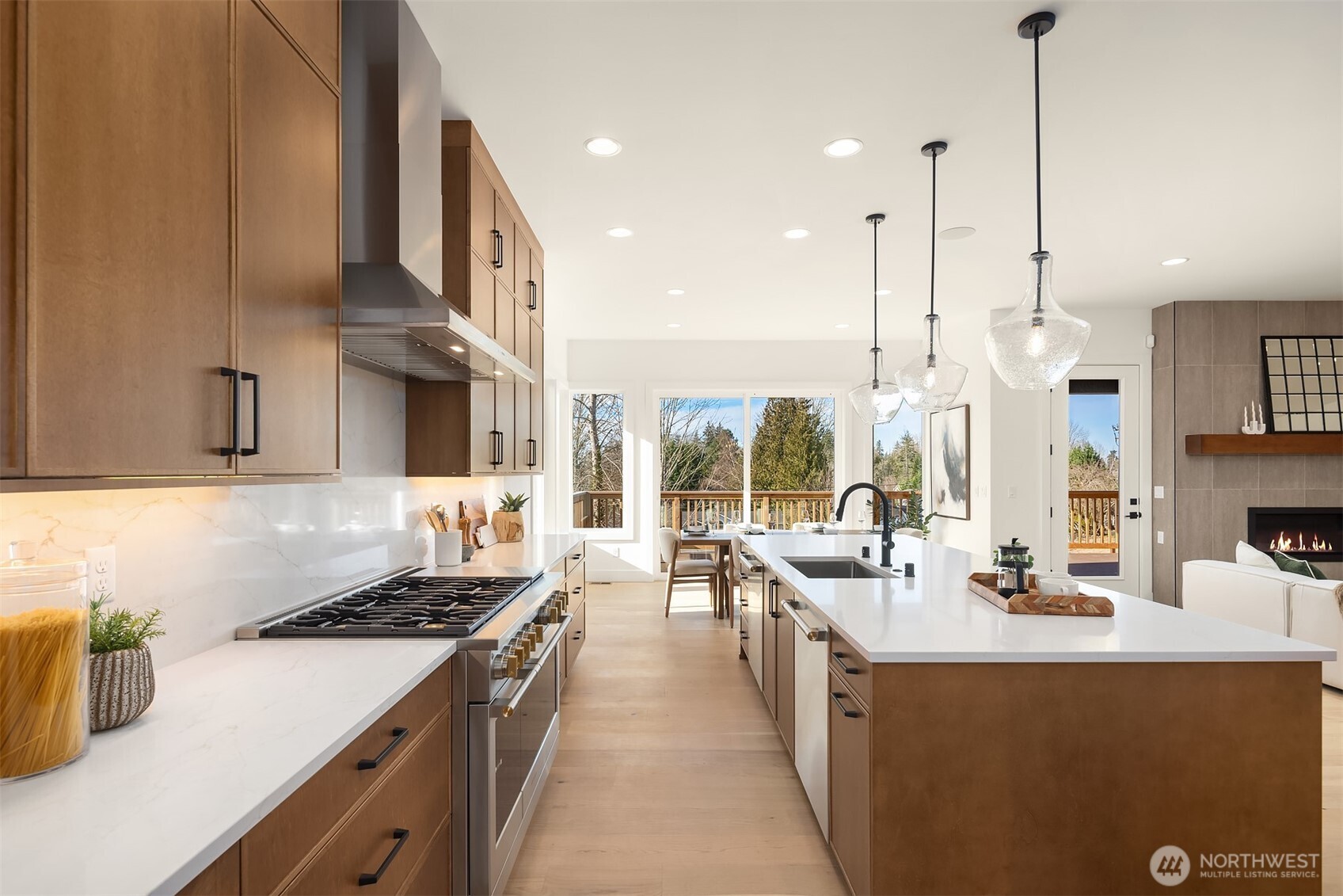 510 Nile Avenue Northeast Renton, WA 98059 - Photo 8 of 40 a kitchen with stainless steel appliances a stove a sink a oven a dining table and chairs