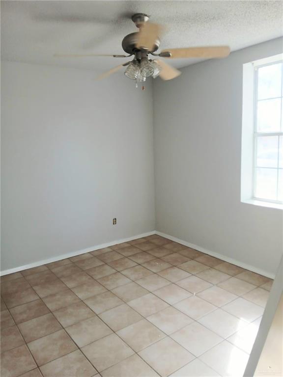 2124 Iris Avenue McAllen, TX 78501 - Photo 7 of 10 a view of a room that has a fan and a window
