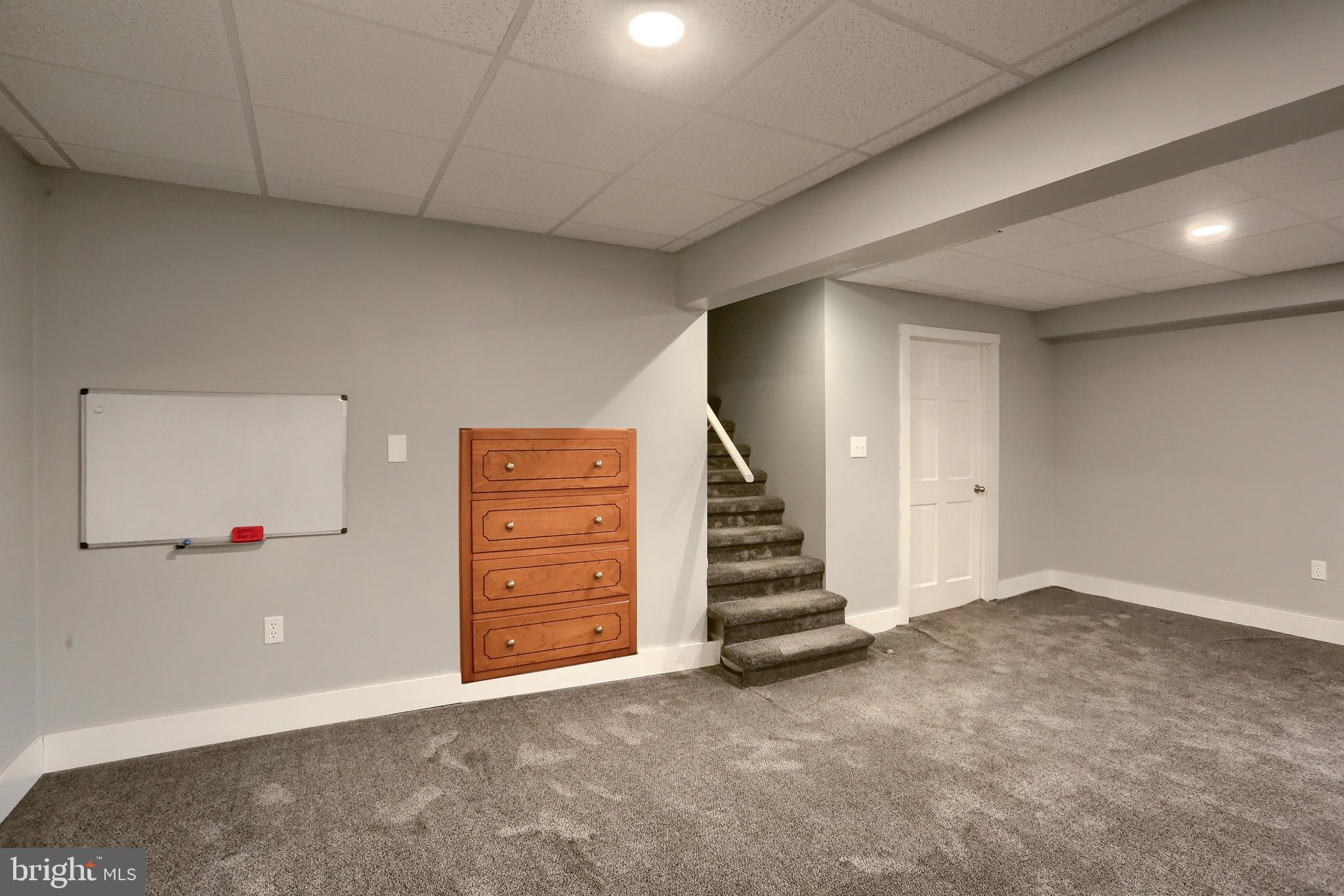 509 Shaffer Road Millersburg, PA 17061 - Photo 12 of 28 an empty room with a hallway and stairs