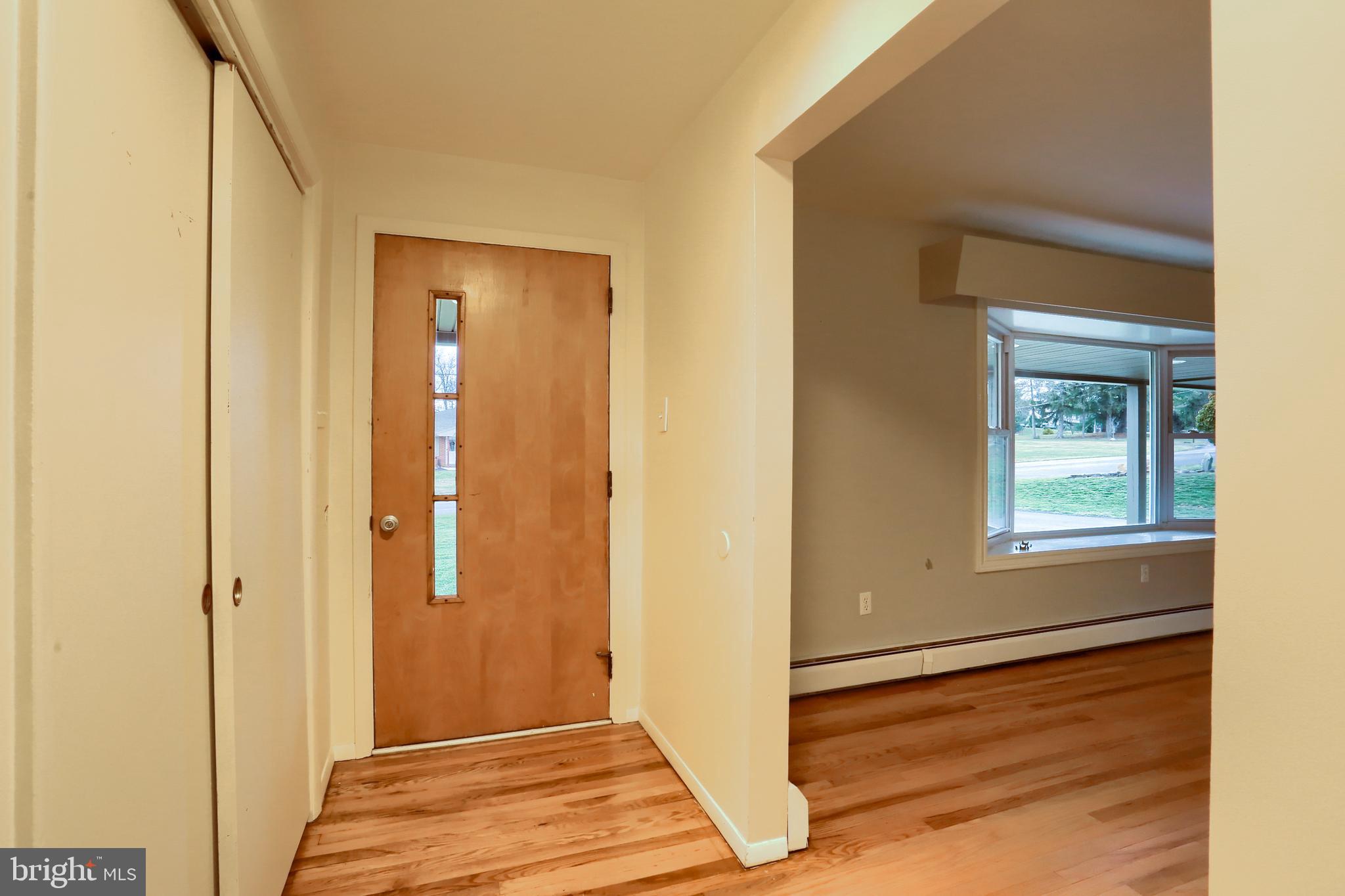 509 Shaffer Road Millersburg, PA 17061 - Photo 21 of 28 a view of an empty room with wooden floor and a window