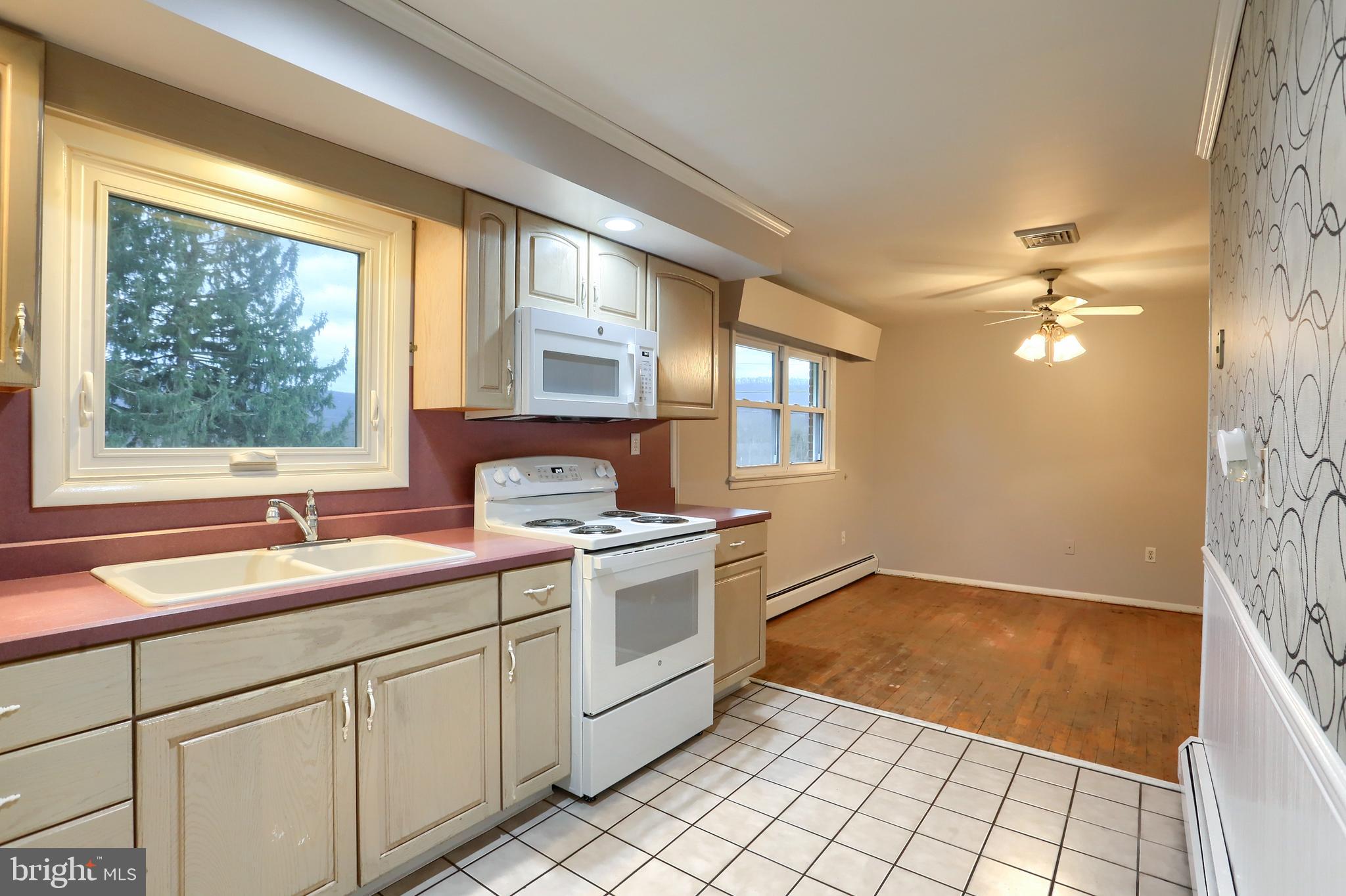 509 Shaffer Road Millersburg, PA 17061 - Photo 23 of 28 a kitchen with a sink cabinets and window