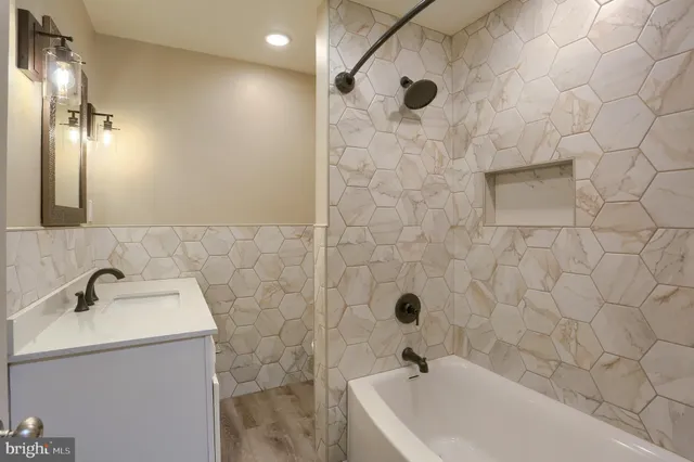 a bathroom with a sink and shower