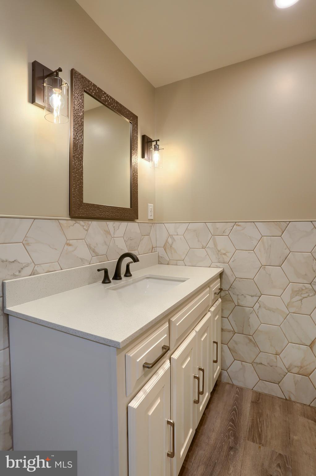 509 Shaffer Road Millersburg, PA 17061 - Photo 7 of 28 a bathroom with a sink a vanity and a mirror