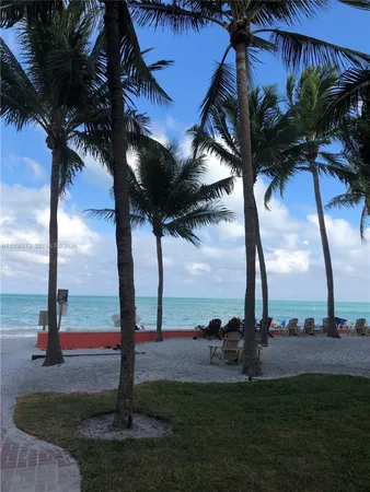 a view of swimming pool with outdoor seating