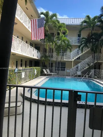 a view of a park with palm trees