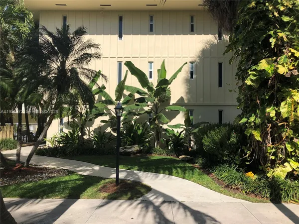 a view of a palm trees next to a house