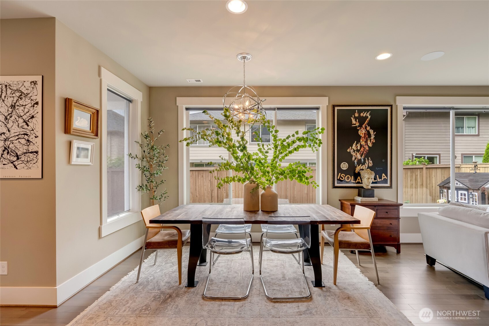 619 Graham Avenue Northeast Renton, WA 98059 - Photo 11 of 40 a living room with furniture and a chandelier