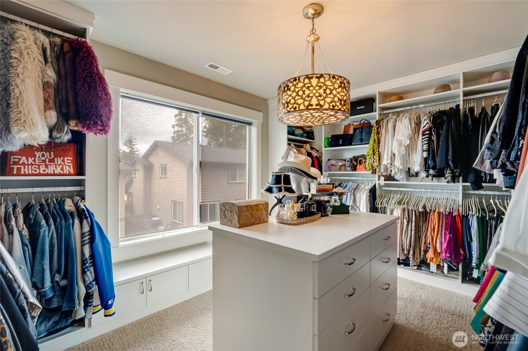 619 Graham Avenue Northeast Renton, WA 98059 - Photo 31 of 40 a view of walk in closet with clothes and shoes