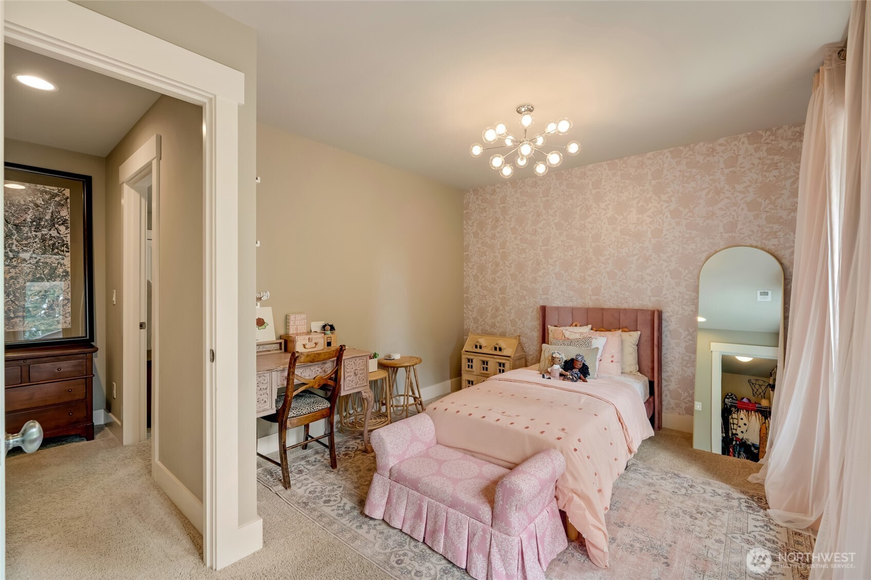 619 Graham Avenue Northeast Renton, WA 98059 - Photo 33 of 40 a bedroom with a bed and a chandelier