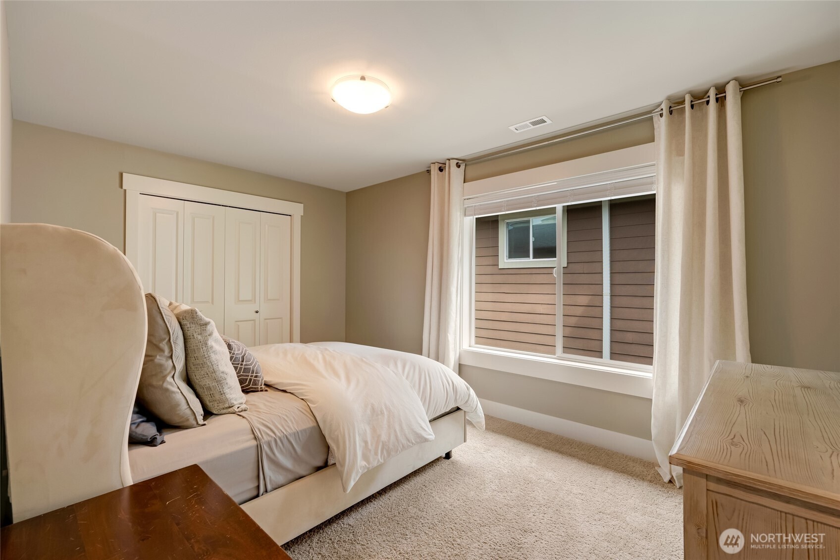 619 Graham Avenue Northeast Renton, WA 98059 - Photo 34 of 40 a bed room with a bed and a window