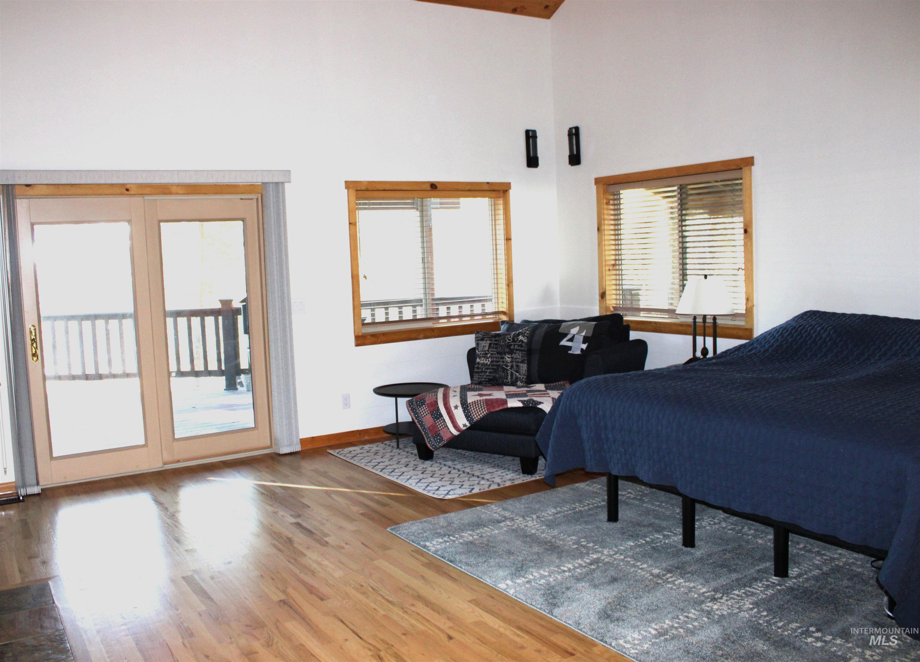 31 Rainbow Ridge Road Garden Valley, ID 83622 - Photo 18 of 33 Primary featuring wood floors, access to outside, sitting area and a high ceiling