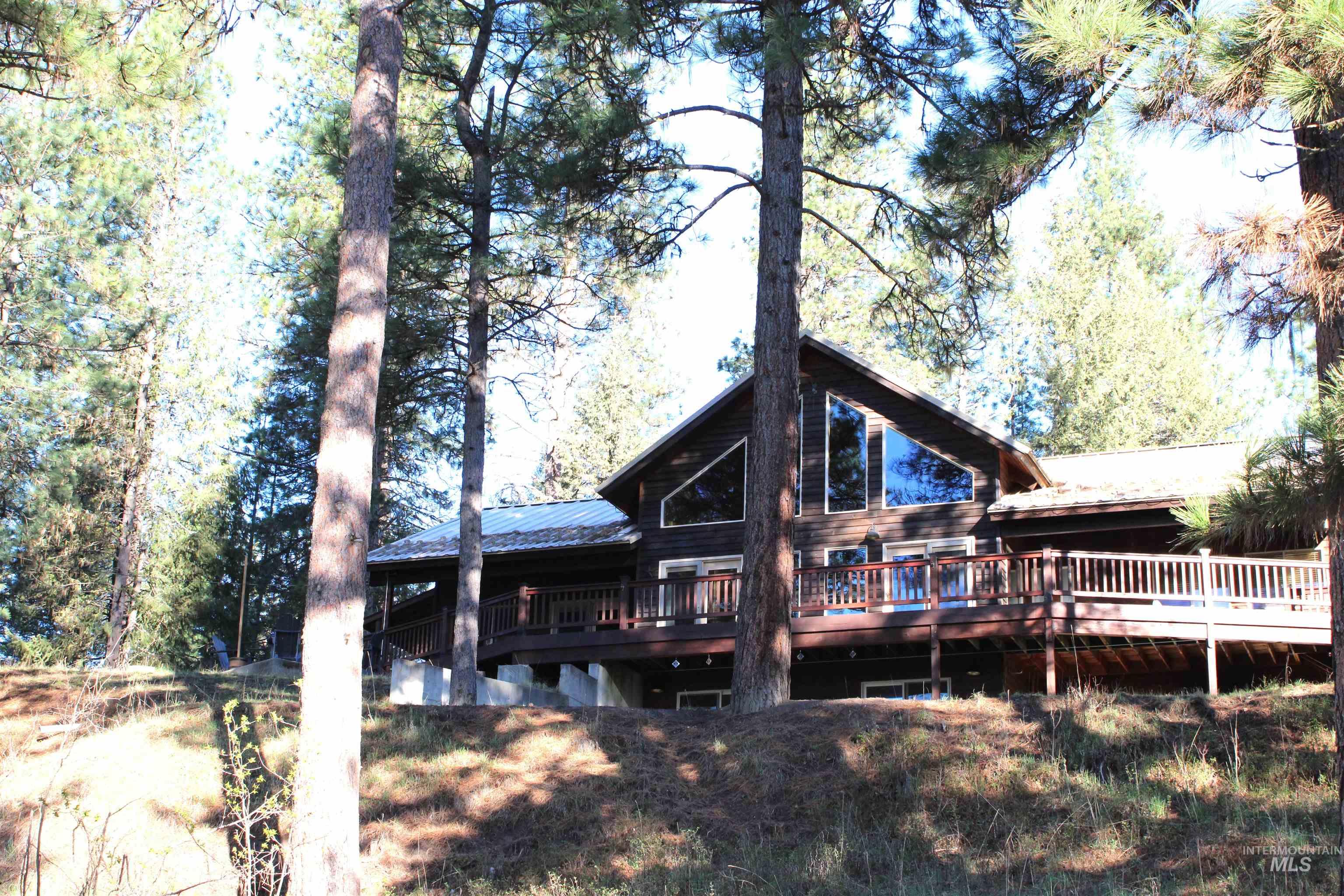 31 Rainbow Ridge Road Garden Valley, ID 83622 - Photo 28 of 33 Rear view of house with a deck and a metal roof