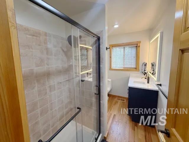 31 Rainbow Ridge Road Garden Valley, ID 83622 - Photo 8 of 33 Bathroom featuring vanity, a stand up shower, light wood flooring, recessed lighting and backlit mirror