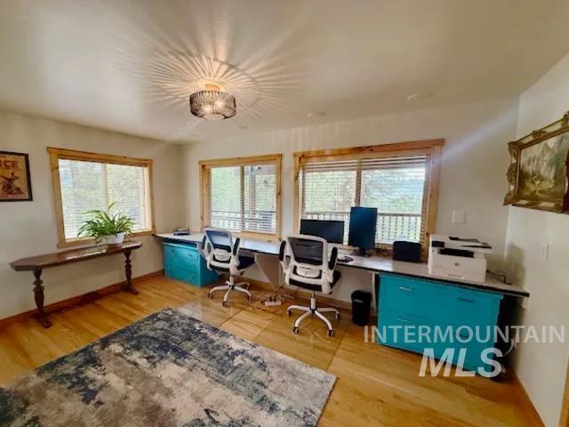 31 Rainbow Ridge Road Garden Valley, ID 83622 - Photo 9 of 33 Bedroom 3 set up as office, featuring wood flooring and natural light