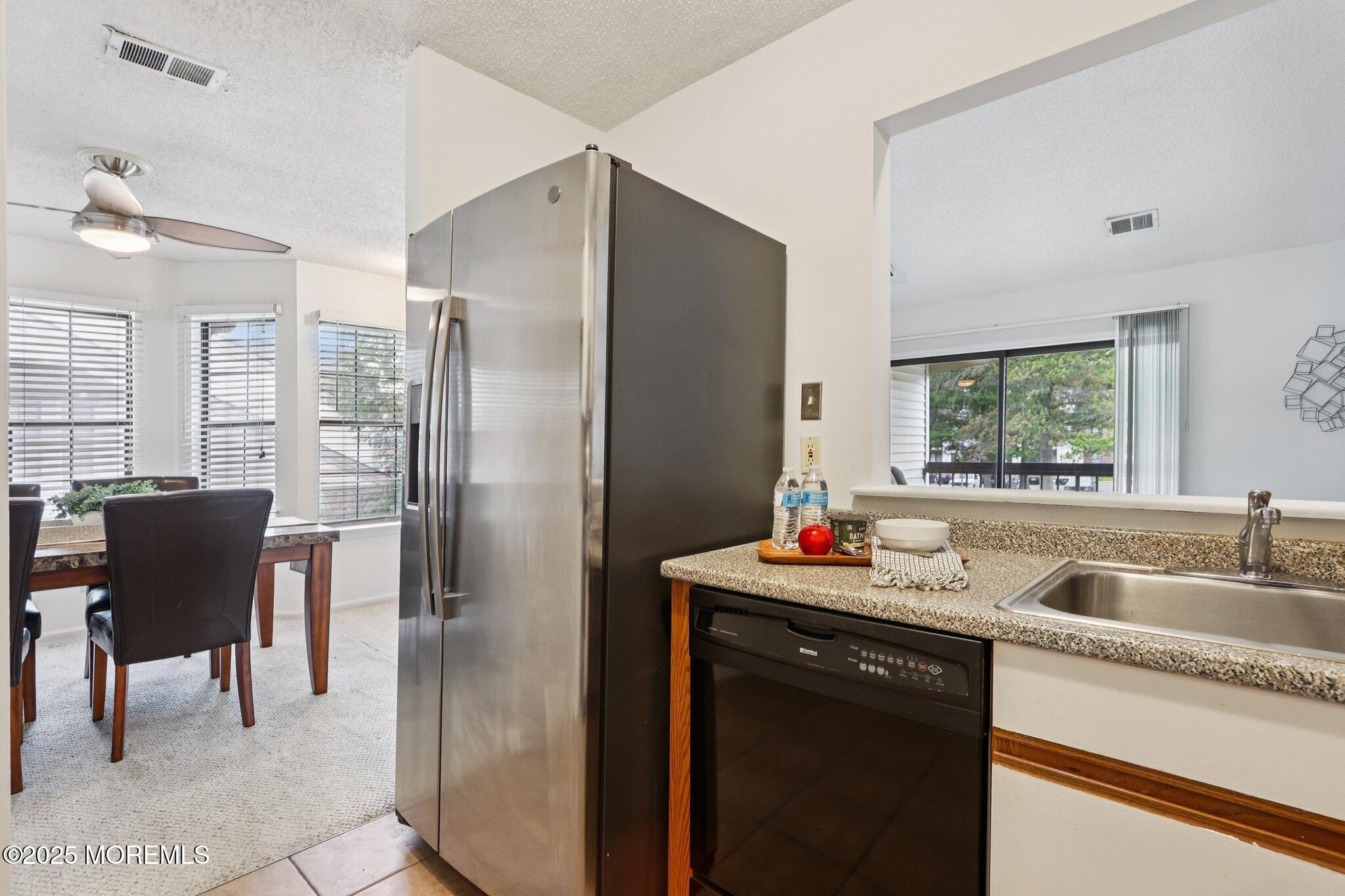 3015 Lighthouse Lane, Unit 3015 Parlin, NJ 08859 - Photo 13 of 22 a kitchen with a sink cabinets and refrigerator