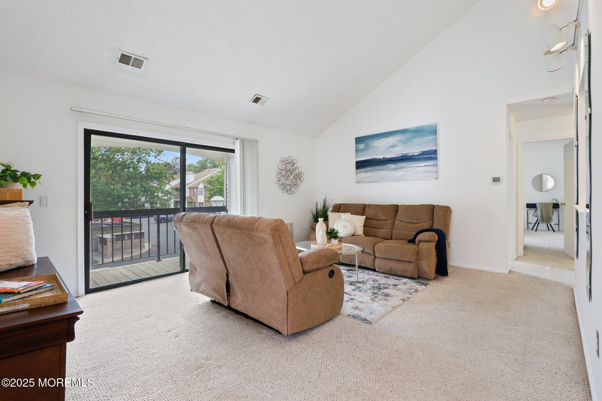 3015 Lighthouse Lane, Unit 3015 Parlin, NJ 08859 - Photo 5 of 22 a living room with furniture and a floor to ceiling window