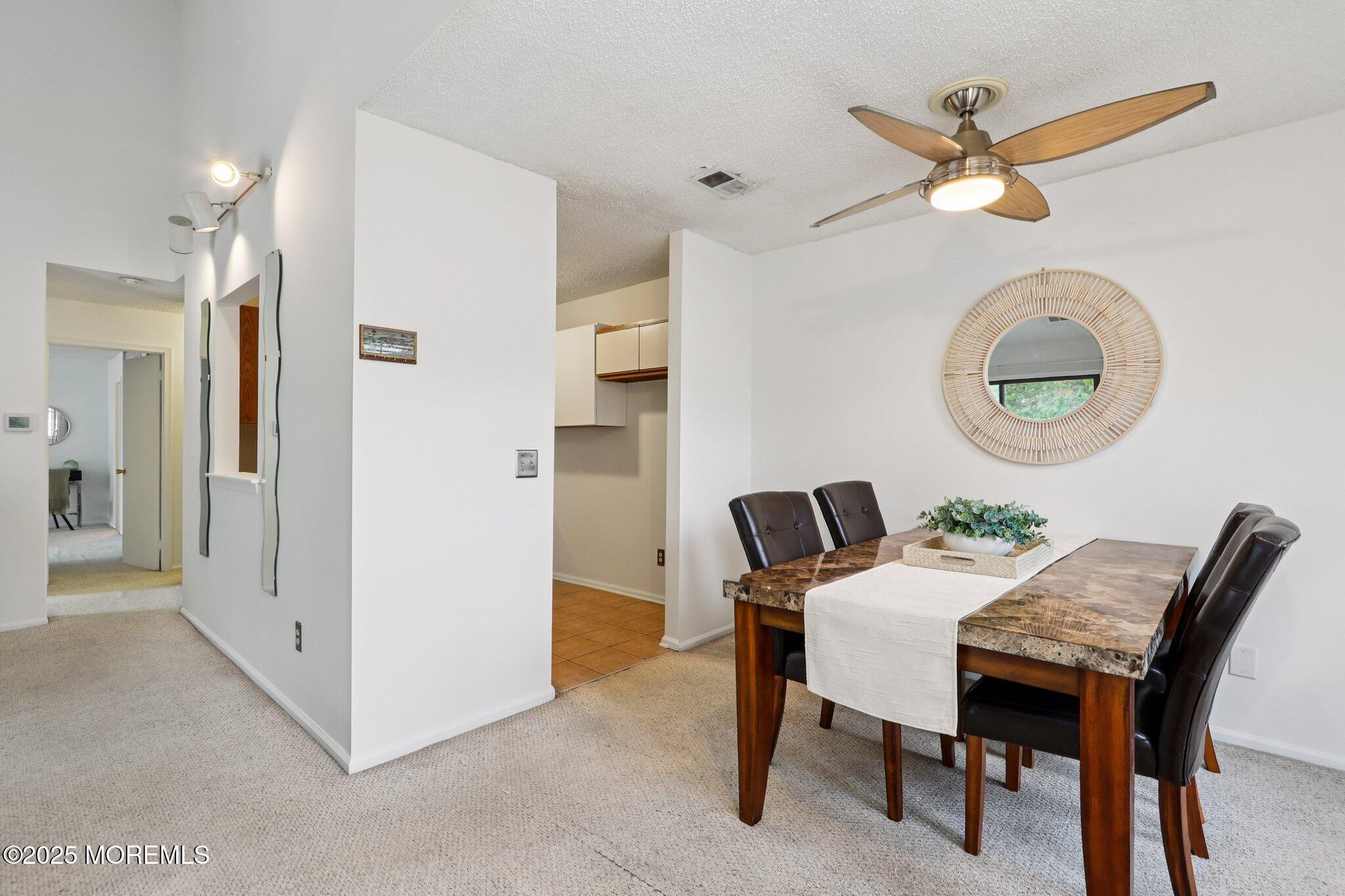 3015 Lighthouse Lane, Unit 3015 Parlin, NJ 08859 - Photo 8 of 22 a dining room with furniture and a window