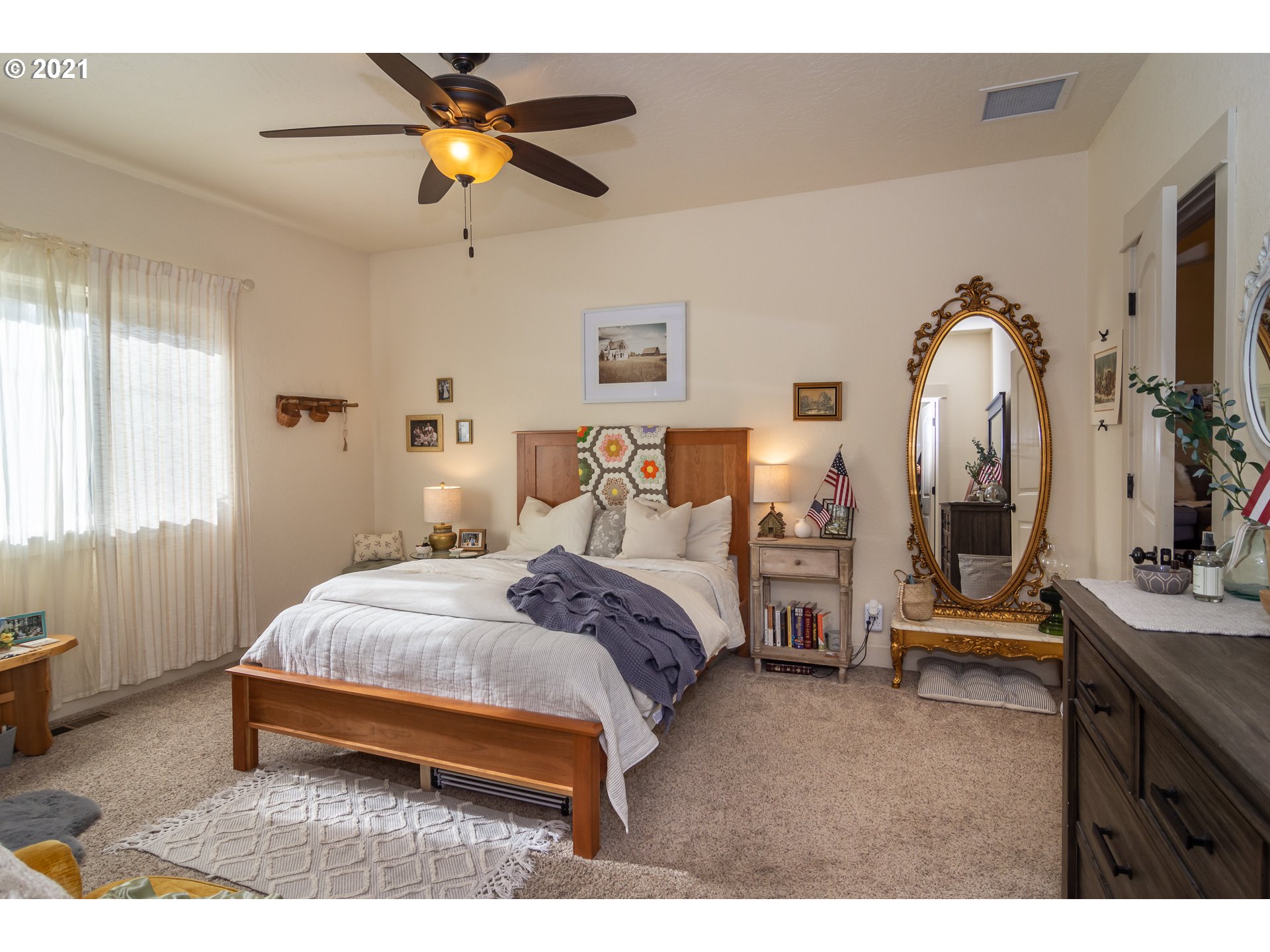 463 South 47th Street Springfield, OR 97478 - Photo 13 of 25 a bedroom with a bed and a chandelier