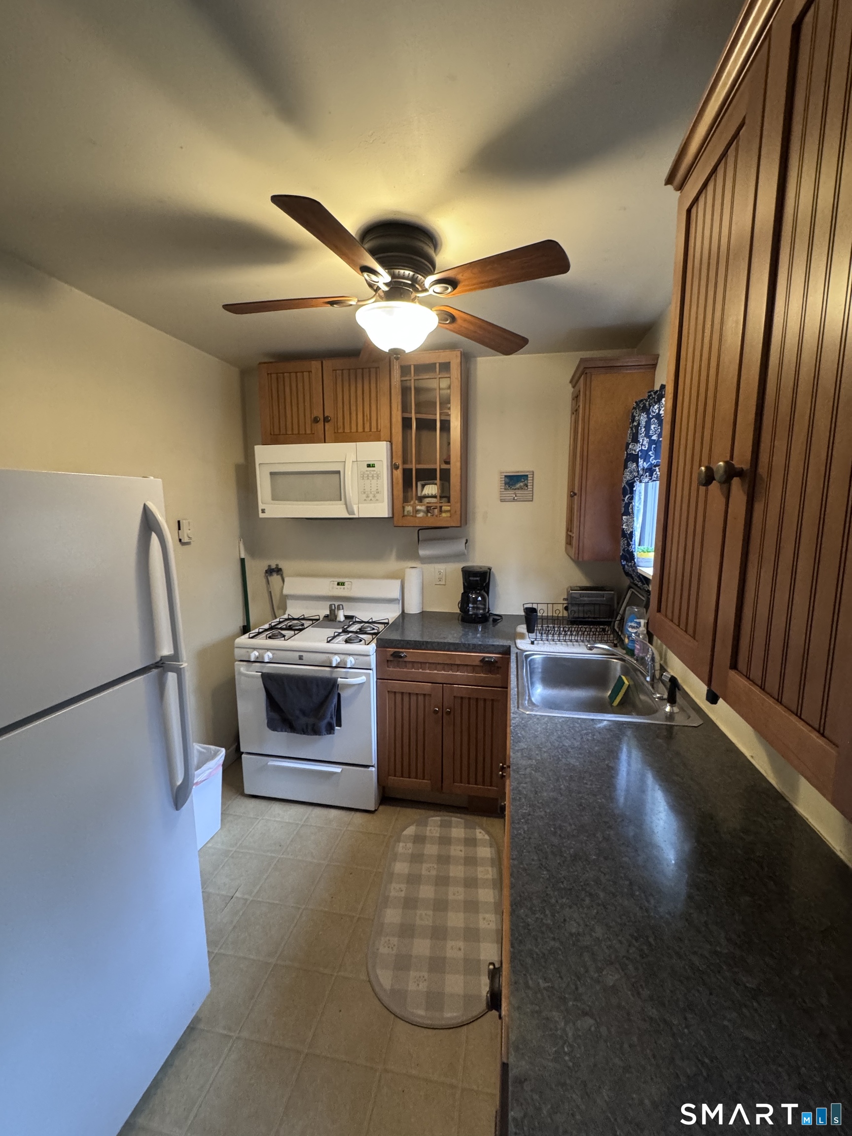 40 Flood Bridge Road Southbury, CT 06488 - Photo 4 of 15 a kitchen with stainless steel appliances a stove a sink and a refrigerator