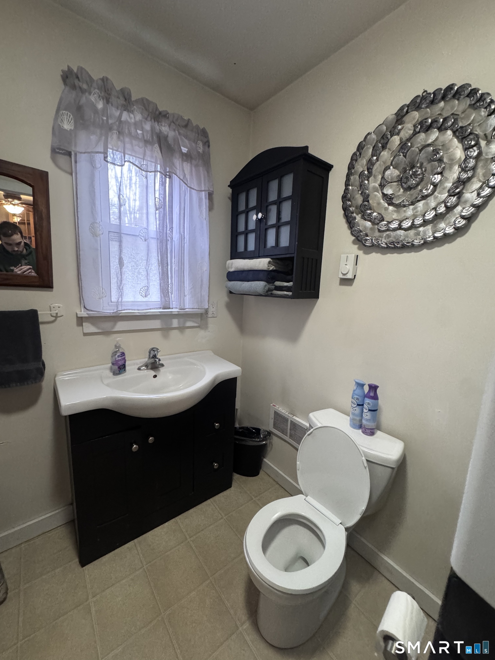 40 Flood Bridge Road Southbury, CT 06488 - Photo 6 of 15 a bathroom with a sink a toilet and a mirror