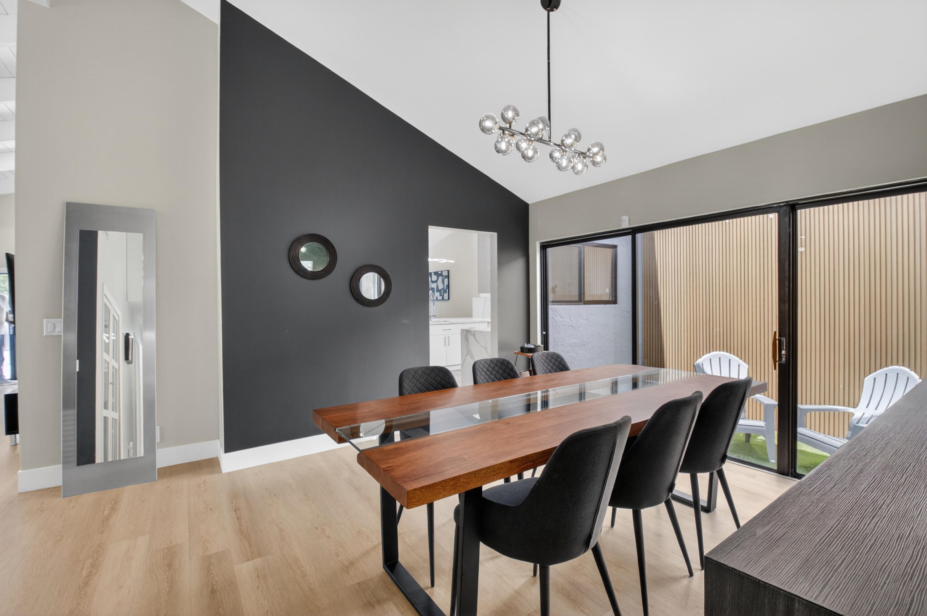 7374 Woodmont Court Boca Raton, FL 33434 - Photo 23 of 95 a view of a dining room with furniture window and wooden floor