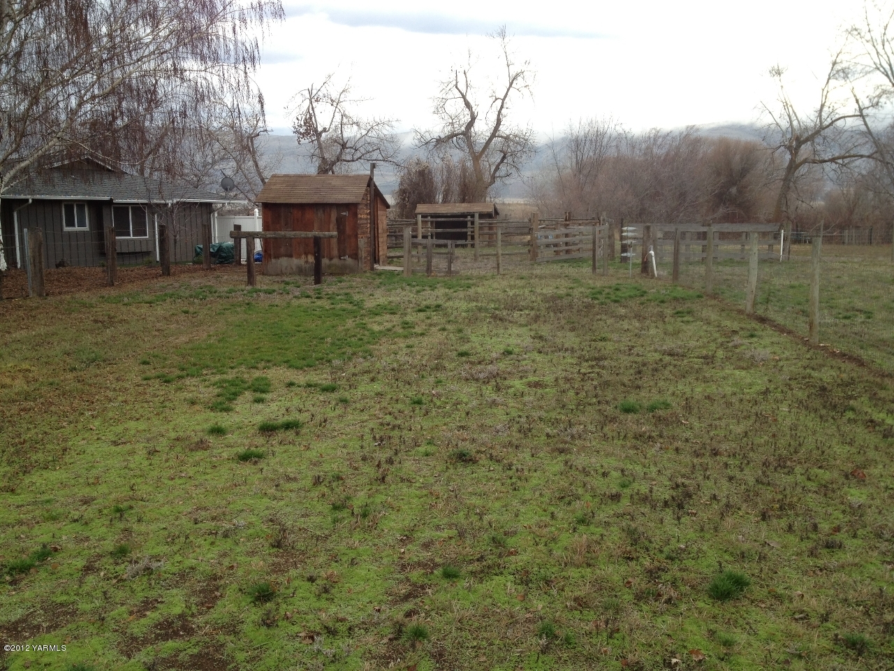 8004 Rutherford Road Yakima, WA 98903 - Photo 17 of 42 a backyard of a house with table and chairs