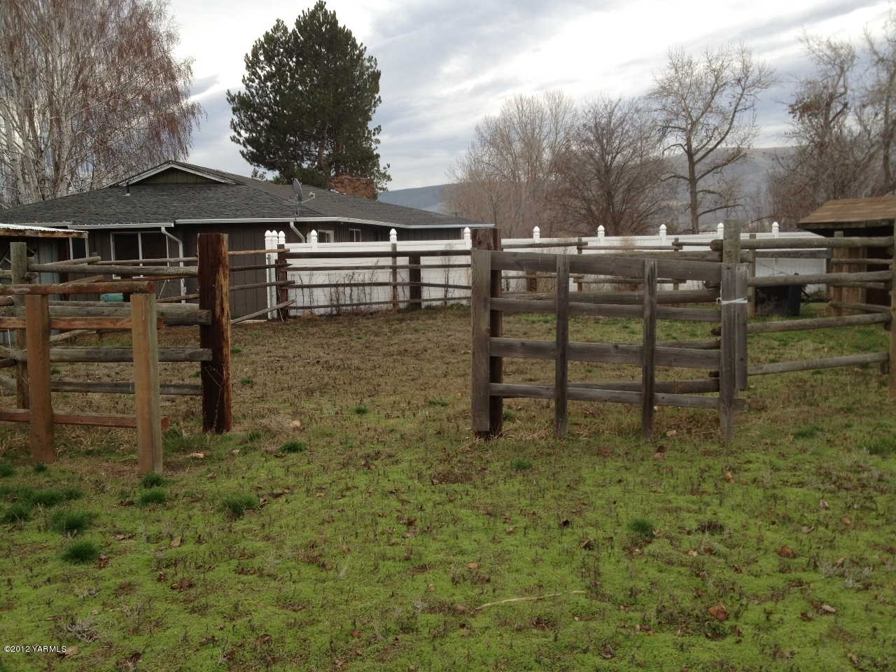 8004 Rutherford Road Yakima, WA 98903 - Photo 22 of 42 a view of a wooden chairs and table in the backyard