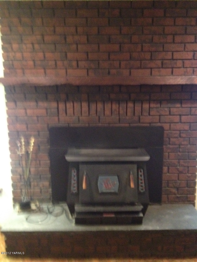8004 Rutherford Road Yakima, WA 98903 - Photo 40 of 42 a stove top oven sitting inside of a kitchen