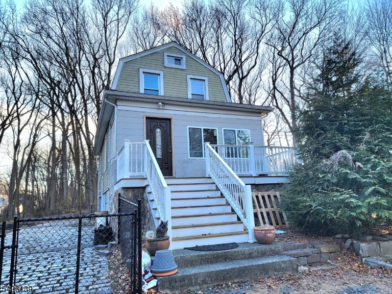 906 Center Street Scotch Plains, NJ 07076 - Photo 1 of 11 a front view of a house with a yard