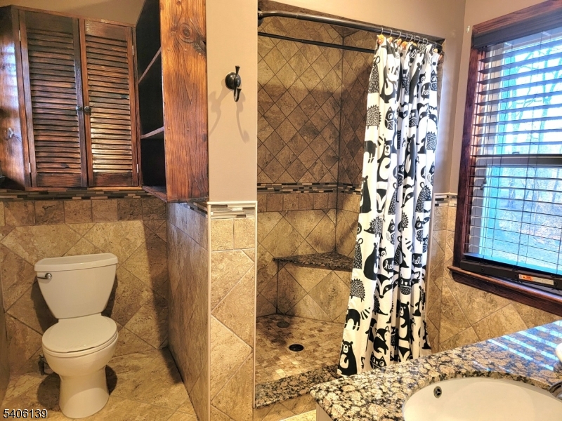 906 Center Street Scotch Plains, NJ 07076 - Photo 4 of 11 a bathroom with a toilet and shower