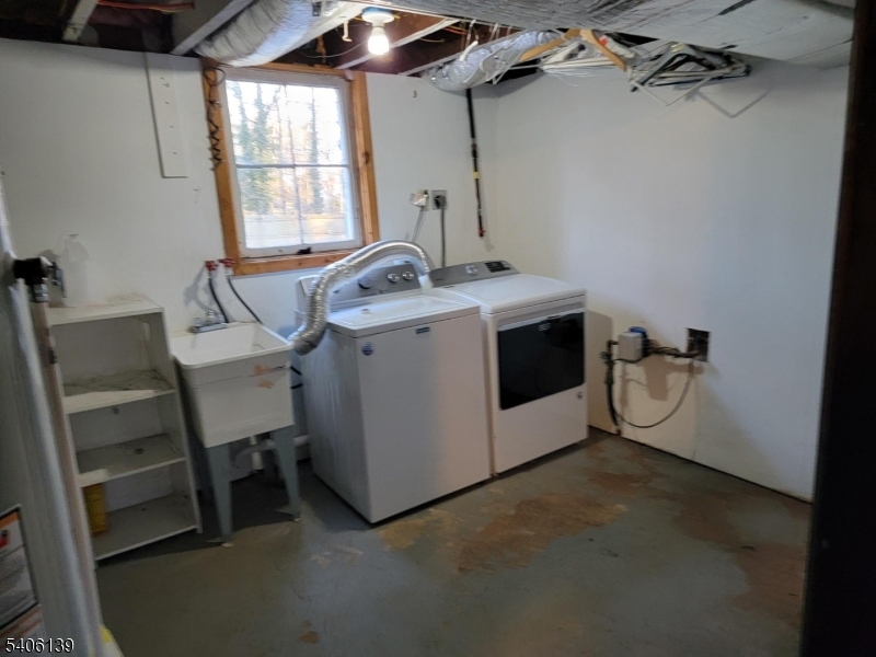906 Center Street Scotch Plains, NJ 07076 - Photo 7 of 11 a utility room with dryer and washer