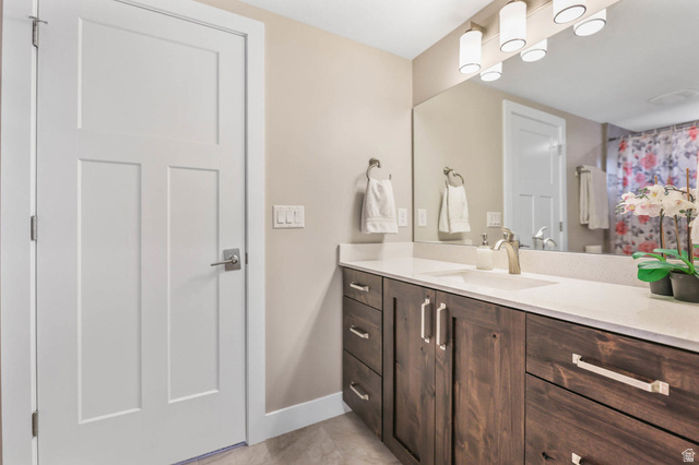 4527 North Seven Bridges Road Eden, UT 84310 - Photo 28 of 65 Bathroom featuring vanity, light tile patterned floors, and a shower with shower curtain