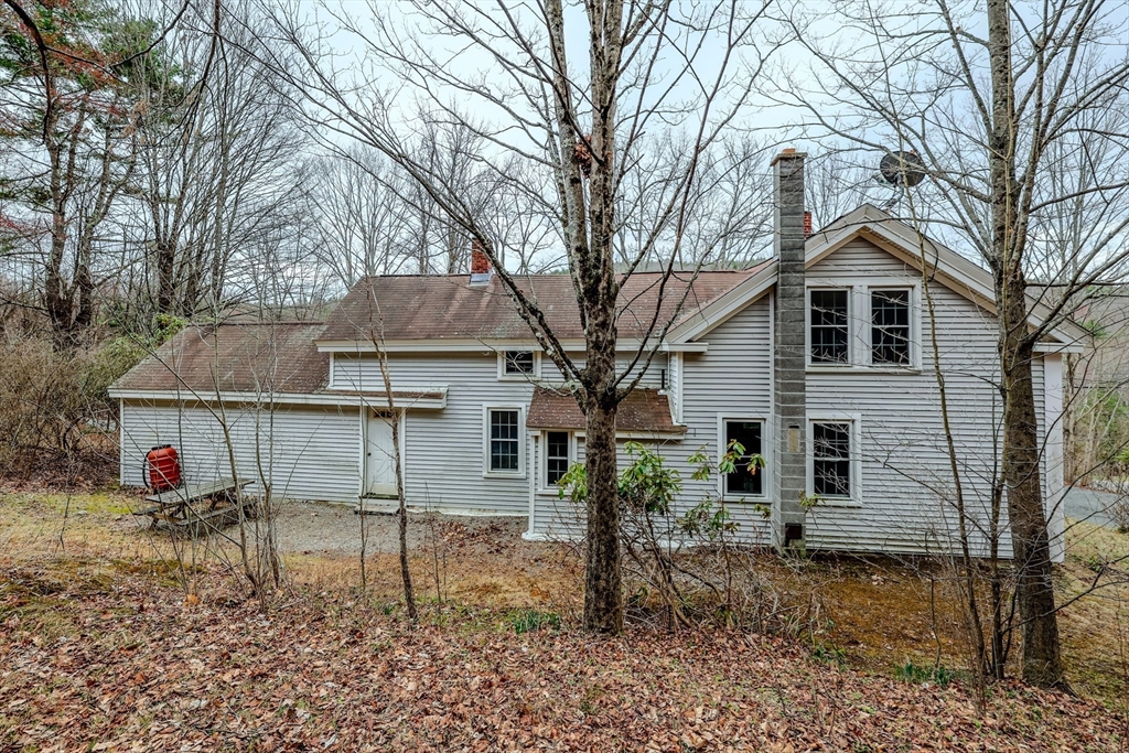 118 North Leverett Road Leverett, MA 01054 - Photo 3 of 26 a backyard of a house with table and chairs