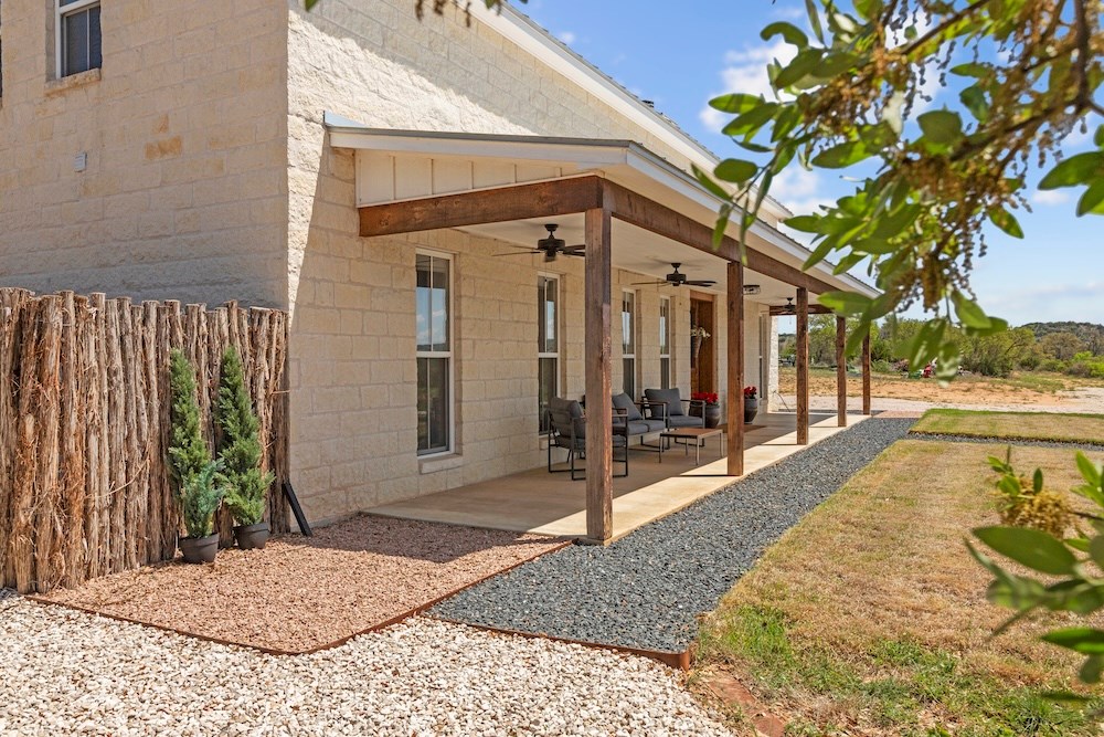 792 Langes Mill Road Doss, TX 78618 - Photo 11 of 76 a view of a house with a porch