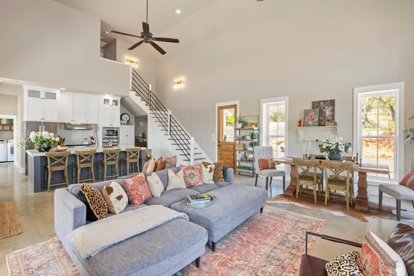 a kitchen with stainless steel appliances a stove a sink a microwave a refrigerator and cabinets