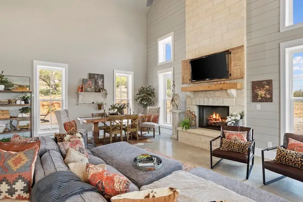 a kitchen with stainless steel appliances granite countertop a stove a microwave and cabinets