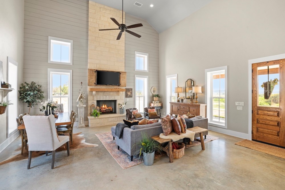 792 Langes Mill Road Doss, TX 78618 - Photo 19 of 76 a living room with furniture and a fireplace
