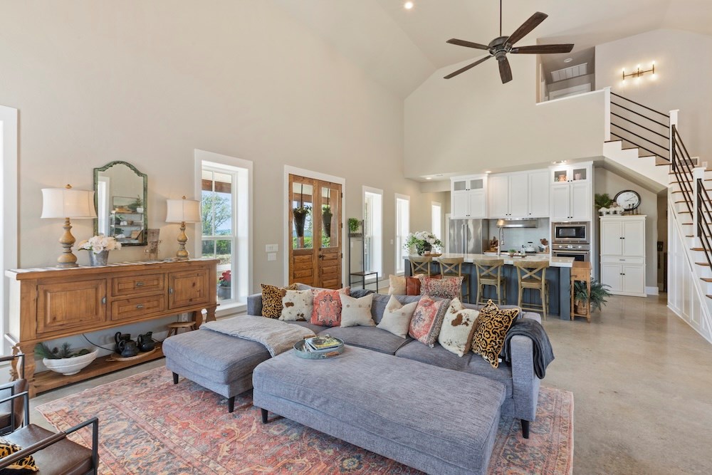 792 Langes Mill Road Doss, TX 78618 - Photo 21 of 76 a living room with furniture and a chandelier