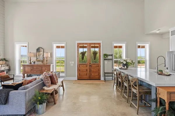a kitchen with stainless steel appliances kitchen island granite countertop a sink and a stove