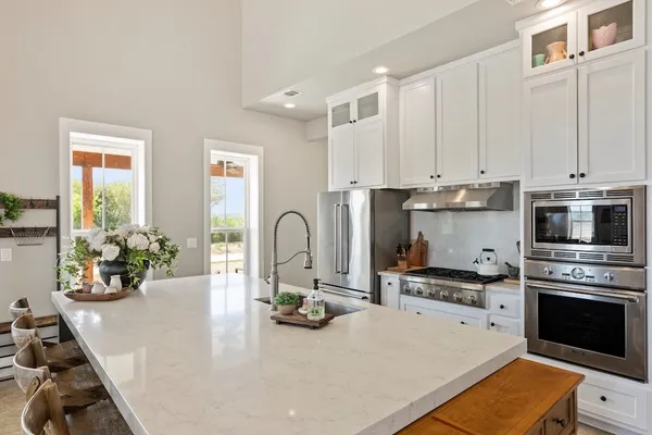 a bedroom with furniture and a book shelf