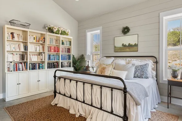 a room with furniture and a large window