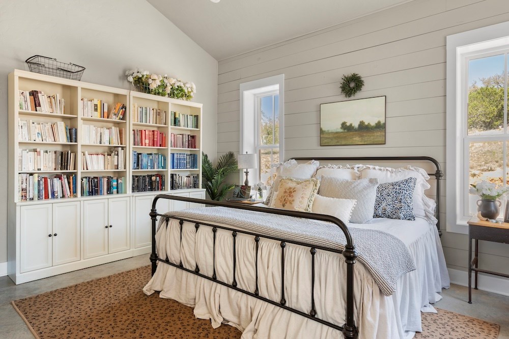 792 Langes Mill Road Doss, TX 78618 - Photo 36 of 76 a bedroom with furniture and a book shelf