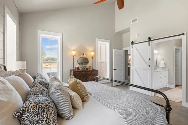 a bedroom with a bed and a closet