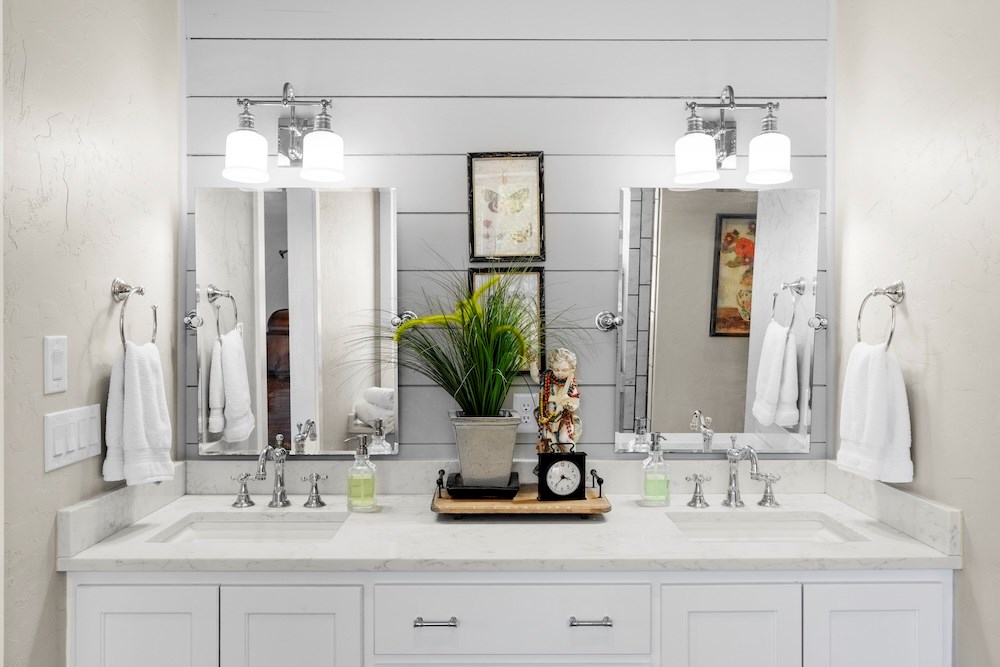 792 Langes Mill Road Doss, TX 78618 - Photo 41 of 76 a bathroom with double vanity sinks and a mirror