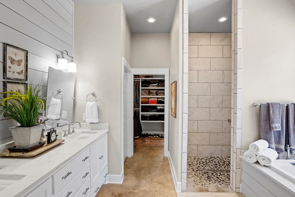 792 Langes Mill Road Doss, TX 78618 - Photo 42 of 76 a bathroom with a sink a potted plant and a shower