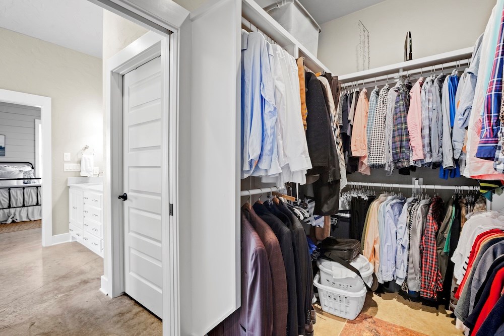 792 Langes Mill Road Doss, TX 78618 - Photo 46 of 76 a view of walk in closet with clothes
