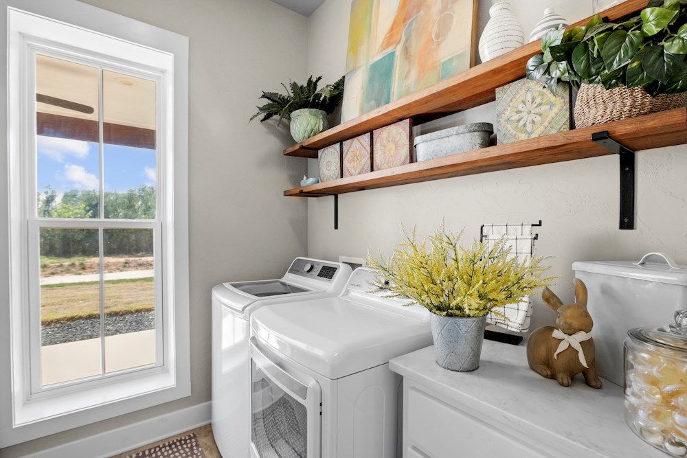 792 Langes Mill Road Doss, TX 78618 - Photo 48 of 76 a bathroom with a sink a mirror and a potted plant